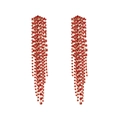 Detailed view of long gold tassel earrings with shimmering red rhinestones for parties - Red