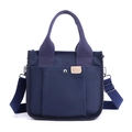 Navy blue canvas tote bag with large front pocket and adjustable shoulder strap - Blue