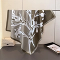 Close-up of olive green square silk scarf featuring white floral iris print patterns - Army Green (FN268-2)
