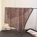 Detail view of brown silk-feel scarf with equestrian horse print and blue border edge - 68*68cm / Light Blue (Equestrian Print)