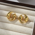 Close-up of polished 18K gold-plated teardrop earrings in a premium velvet display box - Gold
