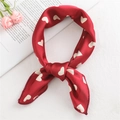 Red satin square scarf with white heart patterns shown as a stylish hair tie or neckerchief - Heart Date Red (FX-11)