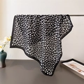 Detail of lightweight leopard print scarf showing soft texture and fine edge stitching - Black