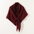 Detailed knit texture of a wine red crossover triangle shawl with soft fabric drape - Burgundy