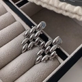 Macro shot of silver multi-layered olive-shaped metal stud earrings on velvet - Silver Style (D214)