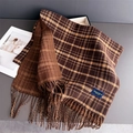 Close-up of double-sided plaid and houndstooth pattern cashmere scarf with tassel fringe - Brown