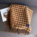 Detailed close-up of cashmere-like plaid scarf with tassels and an elegant woven label - Brown (WT250-2)