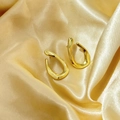 Macro shot of 18K gold plated geometric U-shaped earrings on elegant golden silk fabric - Gold (c107)