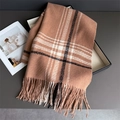 Detail view of brown checkered scarf with soft fringes in a black gift box packaging - Brown