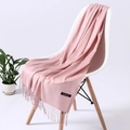 Pink cashmere feel pashmina scarf with elegant fringe detail on a white chair - Baby Pink (FYR150-11)