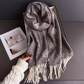 Detailed view of luxury dark grey scarf with camellia floral patterns and white tassels - Grey/White