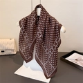 Brown minimalist scarf with white polka dot patterns hanging on a white hanger - 68x68cm / Brown