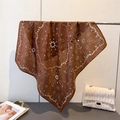 Brown herringbone paisley bandana scarf for women elegantly hung in a stylish display - Dark Brown