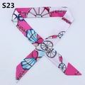 Detail of slender silk twilly scarf with carriage wheel and gold chain pattern - Horse Carriage Wheel Gold Chain (PDS-23)