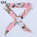 Detailed close-up of pink and white twilly silk scarf with carriage and chain prints - Pink White Classic Horse Carriage (PDS-24)