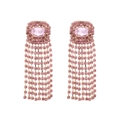 Detail of pink crystal tassel earrings featuring long fringe chains and gold plating - Light Purple