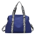 Deep blue nylon waterproof tote bag featuring lettered webbing straps and shoulder strap - Blue