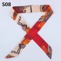 Detailed close-up of a red and beige silk scarf with equestrian horse carriage wheel patterns - Red Cream Orange Carriage (PDS-8)