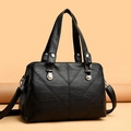 Large black leather shoulder bag with lychee texture and decorative V-shaped stitching - Black