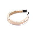 Detailed close-up of wide beige satin headband featuring delicate white pearl embellishments - Champagne (Skin Tone)