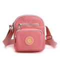 Compact pink oxford fabric crossbody bag with adjustable strap and front pocket - Pink