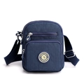 Dark blue nylon crossbody bag with adjustable shoulder strap and multiple zip pockets - Sapphire Blue