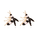 Pendientes de abeja en oro con esmalte negro y blanco sobre fondo blanco minimalista - Negro y Blanco