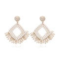 Bohemian raffia tassel drop earrings with geometric weave and ivory fringe - Beige
