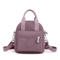 Waterproof nylon crossbody phone bag in dusty rose with adjustable shoulder straps - Dark Pink