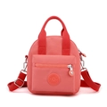 Pink nylon crossbody shoulder bag with front zipper pocket and adjustable strap - Orange