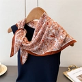 Detail of vintage paisley pattern on silky scarf styled on a blue tank top and wooden hanger - 68*68cm / Dark Brown