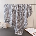 Detail of silk satin scarf featuring grey bamboo ink print and striped border design - 90x90cm / Gray
