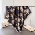 Elegant black silk-like floral scarf with gold chain patterns and tassel prints - Black