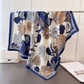Detailed view of large silk-satin scarf with vintage floral prints and elegant drape texture - Navy Blue