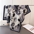 Detail showing hand-drawn floral silk scarf texture with black and white floral pattern - Black