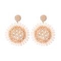 Close-up of bohemian raffia sunflower earrings with woven texture and central bead detail - Off White
