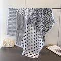 Elegant paisley and polka dot silk-like scarf draped over a stand for stylish women - 90*90cm / White