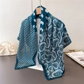 Close-up of a peacock green silk scarf featuring paisley patterns and white polka dots - 90*90cm / Navy Blue