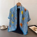Detailed close-up of a satin silk scarf featuring blue stripes and yellow geometric patterns - 90*90cm / Blue (FM242-2)