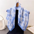 Elegant silk scarf with blue ocean shell print draped on a wooden hanger with bag - 70x70cm / Blue (FG83-3)