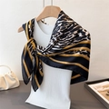 Elegant satin square scarf with leopard print and golden chain patterns on a mannequin - 90x90cm / Black (FM246-2)