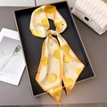 Elegant yellow durian print silk twilly scarf displayed on a minimalist grey tray - Yellow (Durian Print)