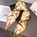 Detail showing elegant autumn leaf pattern twilly scarf on a luxury handbag - Brown (Autumn Leaves Print)