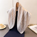 Elegant beige silk-like scarf with paisley and floral patterns on a mannequin - Beige