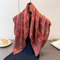 Brown satin square scarf with red cherry prints hanging on a wooden hanger gracefully - 66-70CM / Dark Red