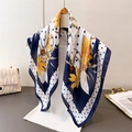 Detailed view of floral and polka dot silk scarf draped on a white model bust - Navy Blue (FG77-1)
