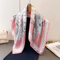 Elegant floral and polka dot silk scarf in pink and white hanging on a hanger - Pink (FG77-4)