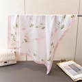 Detail of silk-like floral square scarf with pink borders next to a quilted handbag - Pink (FG78-2 Pink) / 66-70cm
