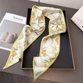 Elegant white satin twilly scarf with yellow citrus print on a minimalist black tray - Green Lemon Print