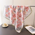 Detail of floral silk scarf showing elegant tulip prints and olive green rolled edges - 70cmx70cm / Pink (Orange-Pink Tulip/Green Border)